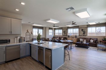 Kitchen and living room l Las Casitas Apartments in Hisperia Ca